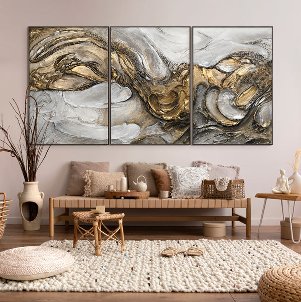 The painting "Tsunami" is an abstract triptych in gold and silver tones
