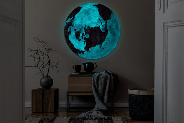 The painting "Shadow of the Continents" is a round abstraction that glows in the dark
