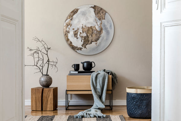 The painting "Shadow of the Continents" is a round abstraction that glows in the dark