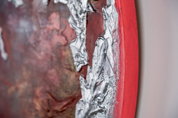 The painting "Pulse of the Planet" is a round art canvas with a textured relief and a fiery glow