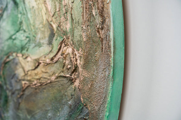 The painting "Green Orbit" is a round textured canvas with a natural character and a glowing effect