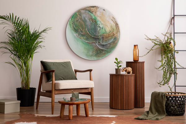 The painting "Green Orbit" is a round textured canvas with a natural character and a glowing effect