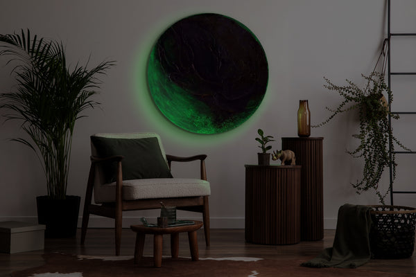 The painting "Green Orbit" is a round textured canvas with a natural character and a glowing effect