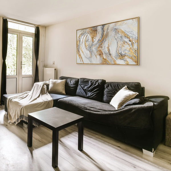 The painting "Traces of the Wind" is an abstract composition in light colors.