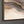The painting “Memory of the Earth” is an abstract composition in natural colors