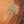 The painting “Amber Flows” is an abstract work in golden brown tones