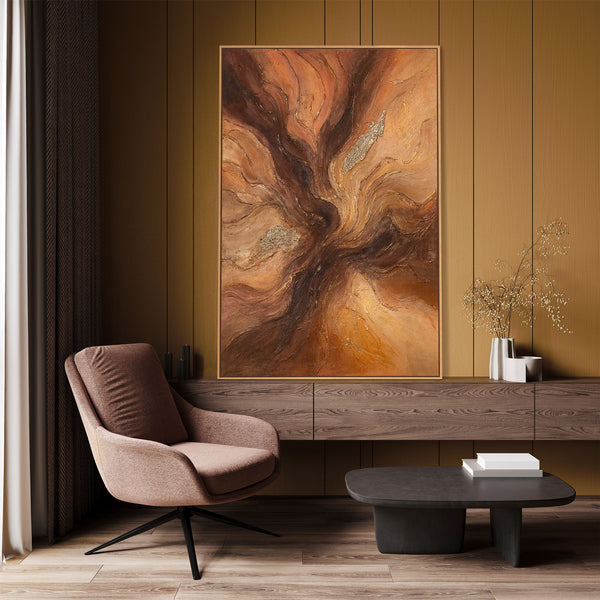 The painting “Amber Flows” is an abstract work in golden brown tones