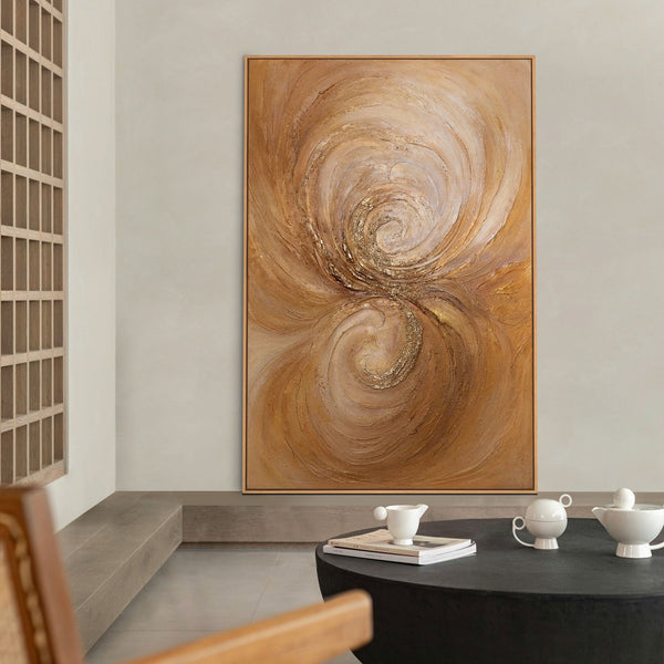 The painting “Warmth Whirlwind” is a textured abstraction in golden-copper tones.