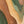 The painting “Dance of the Hills” is an abstract landscape in green tones