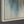The painting “Dawn in the Clouds” depicts dawn over mountain peaks in shades of blue and gold