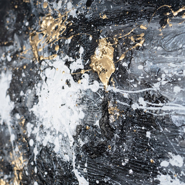The painting "Dance of Splashes" is an abstraction in a black, white, and gold palette.