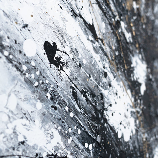 The painting "Dance of Splashes" is an abstraction in a black, white, and gold palette.