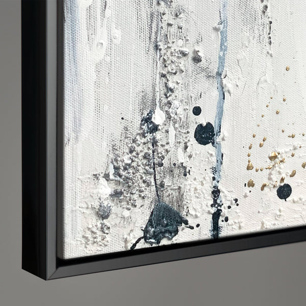The painting "Dance of Splashes" is an abstraction in a black, white, and gold palette.