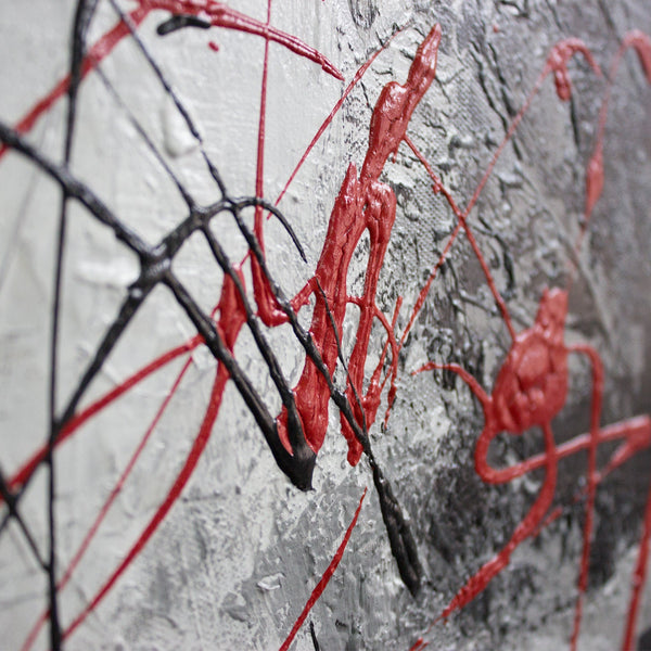 The painting "Courage" is a geometric abstraction with red accents