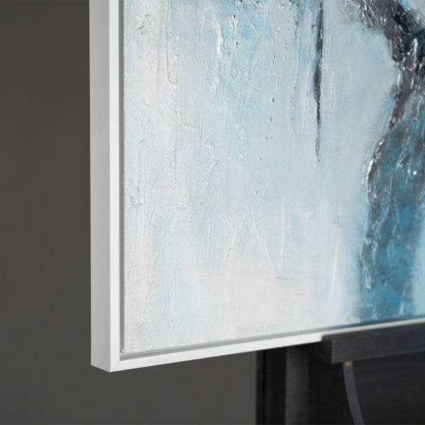 The painting "Ice Abstraction" is a contrast of white and charcoal against a sky-blue background.