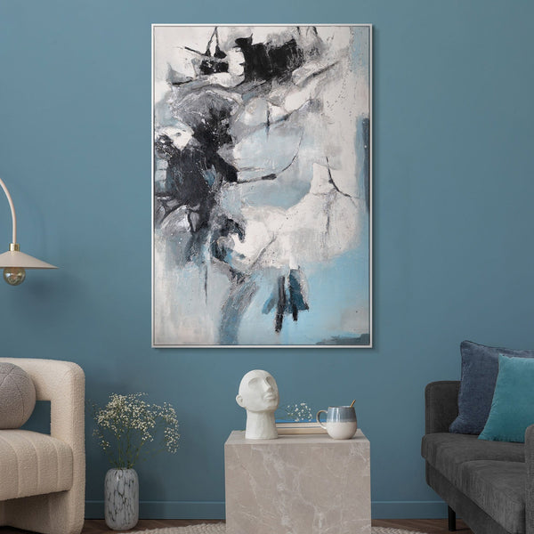 The painting "Ice Abstraction" is a contrast of white and charcoal against a sky-blue background.