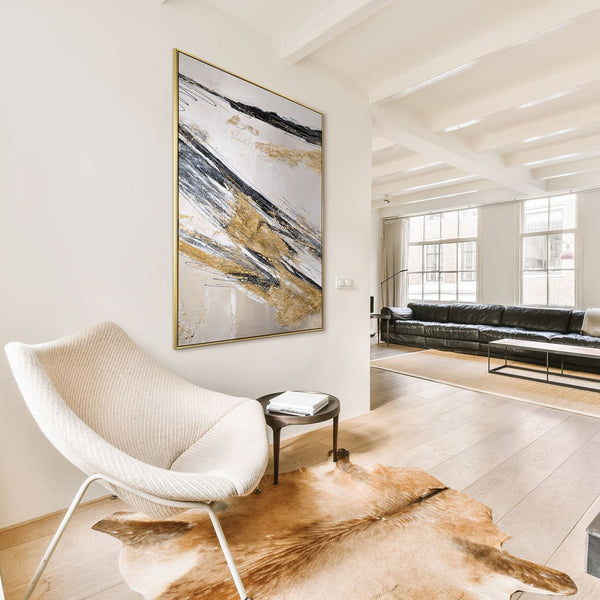 The painting "Lines in the Sand" is a dynamic abstraction in a gold-graphite palette