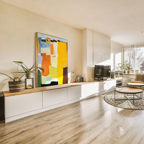 The painting "Sunny Suburbs" is an abstraction with architectural motifs