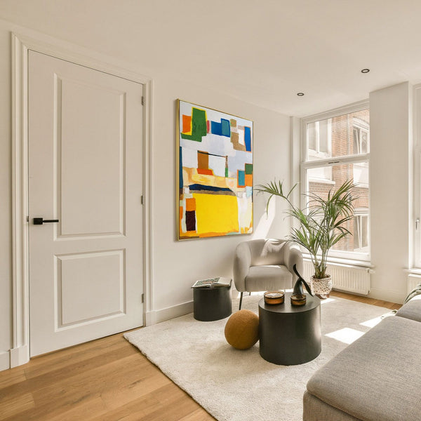 The painting "City Puzzle" is a geometric abstraction in warm colors
