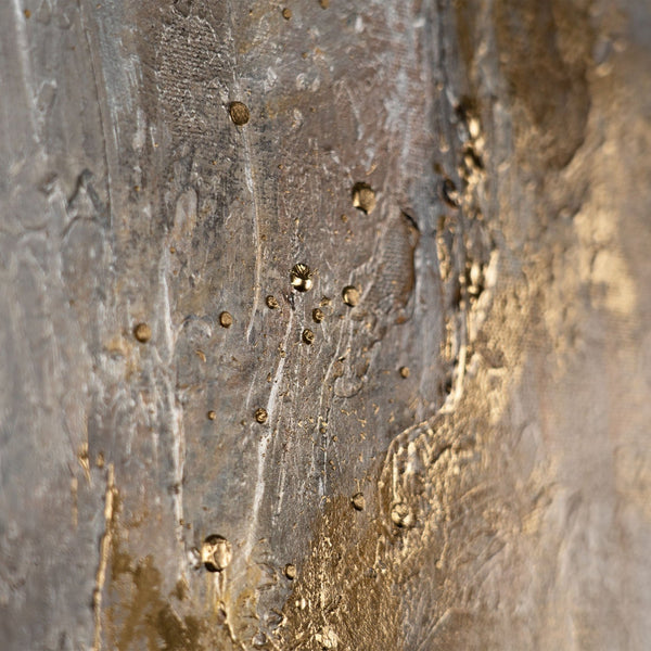 The painting "Traces of Time" is a vertical abstraction with charcoal-gray and bronze-gold tints.