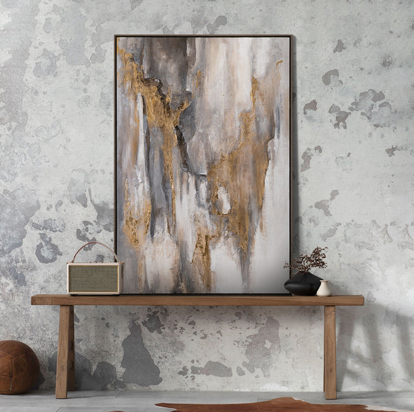 The painting "Traces of Time" is a vertical abstraction with charcoal-gray and bronze-gold tints.