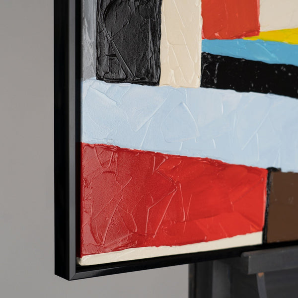 The painting "Architecture of Movement" is a bright geometric abstraction in red and black tones.