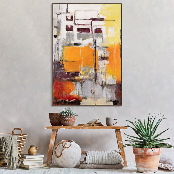 The painting "Urban Glow" is a vertical abstraction with the energy of the sun
