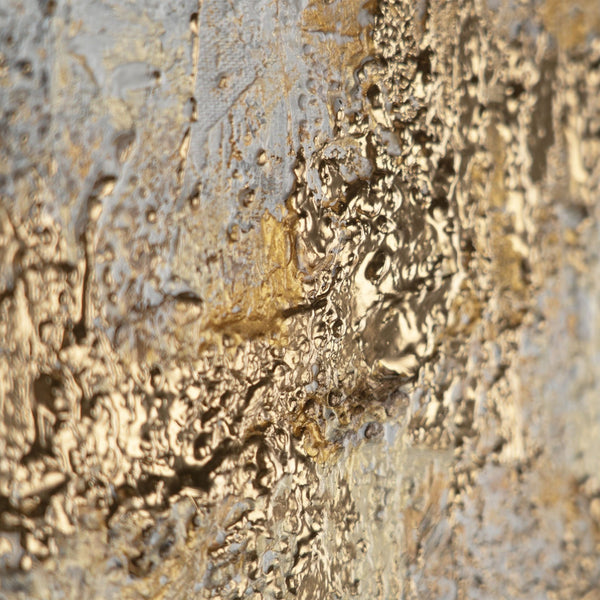The painting "Golden Silence" is a horizontal abstraction with a metallic sheen