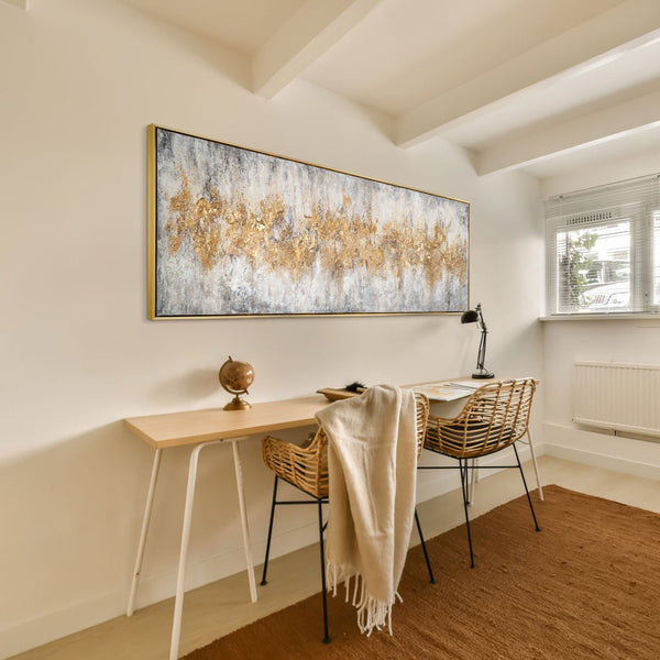 The painting "Golden Silence" is a horizontal abstraction with a metallic sheen