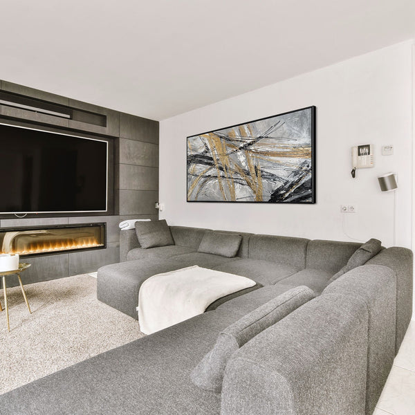 The painting "Mechanics of Motion" is a linear abstraction in metallic tones.